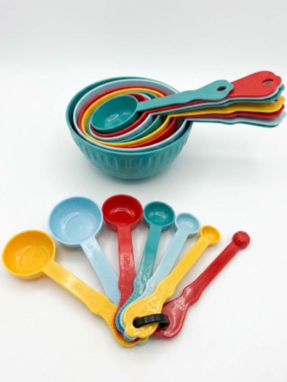 The Pioneer Woman Timeless Beauty multicolor melamine measuring cups and spoons.
